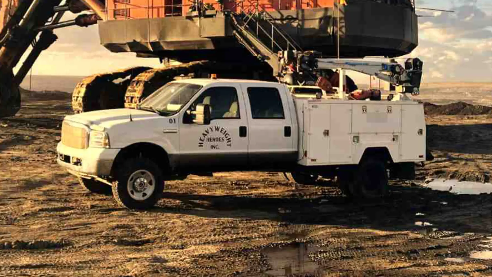 Heavyweight Heroes technician servicing heavy equipment in the field